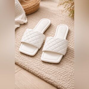 White Quilted Slide Sandals by Katliu